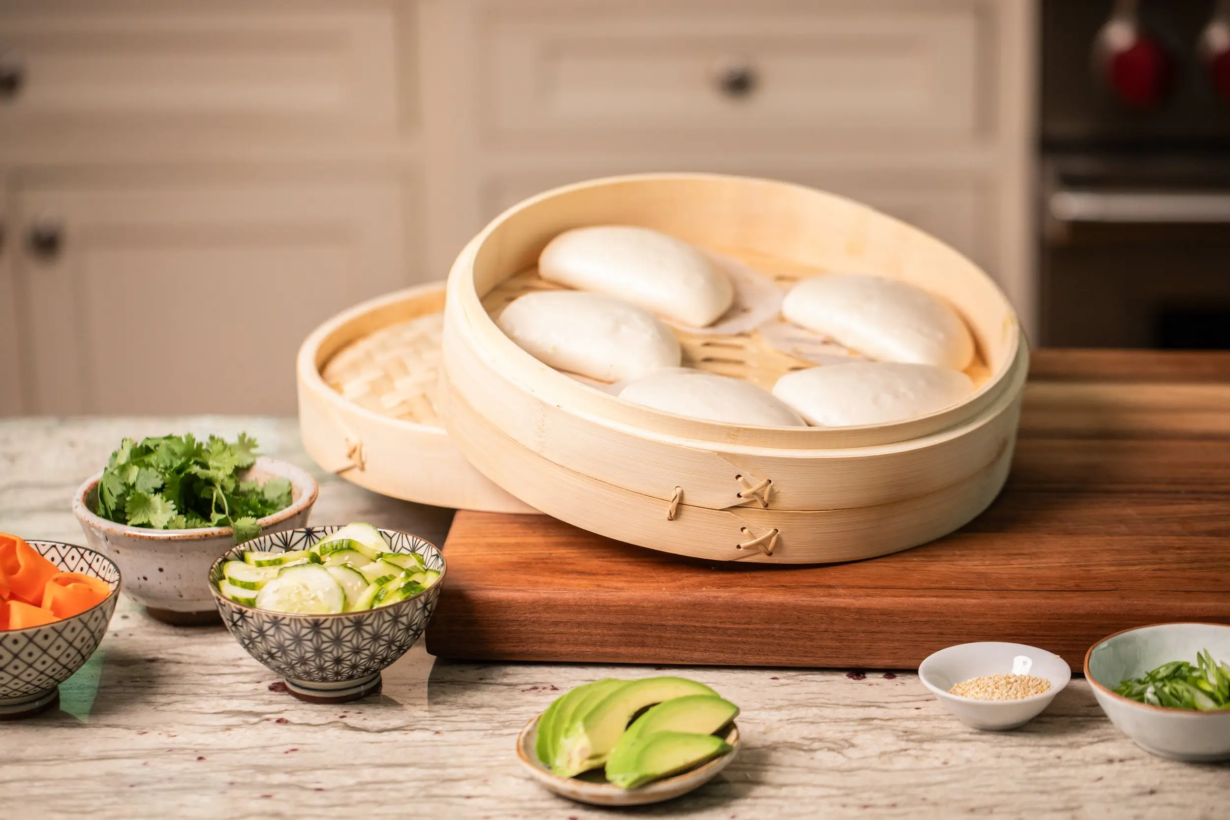 Bao buns witting in steamer with additional MyBacon Bao Buns ingredients