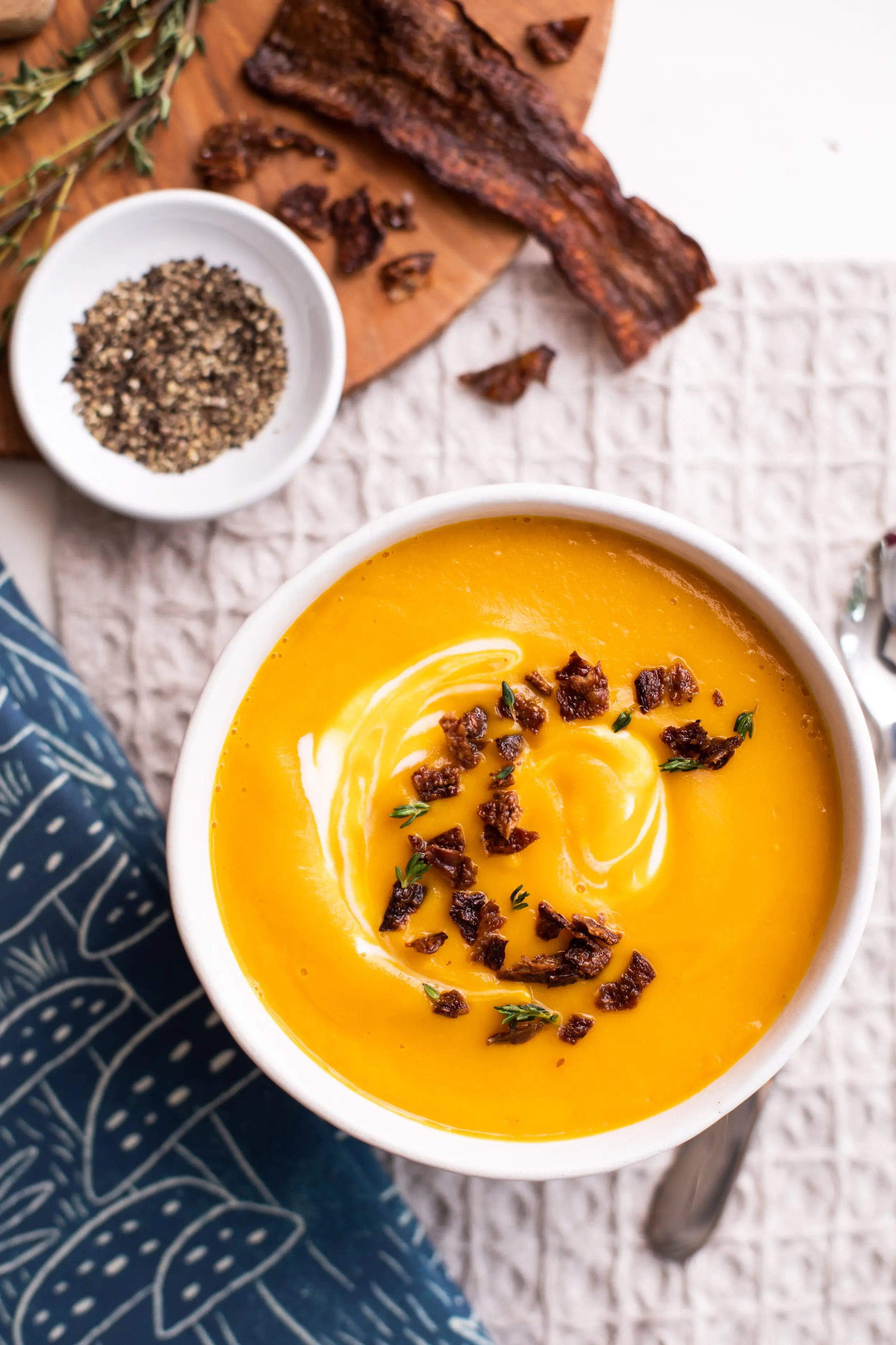 A Delicious bowl of Butternut Squash Soup topped with crumbles of MyBacon