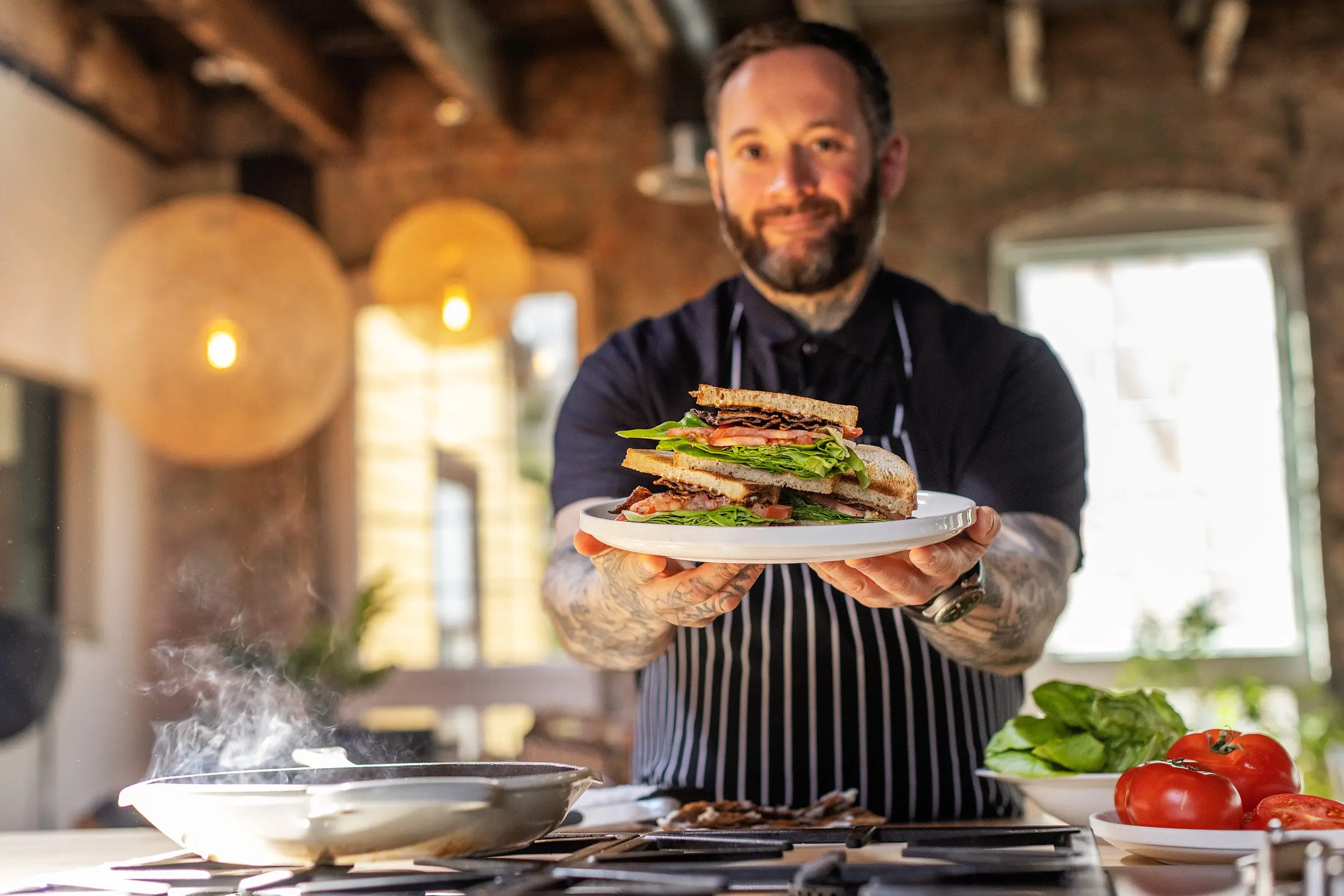 Chef Nick holding a finished MyBacon BLT