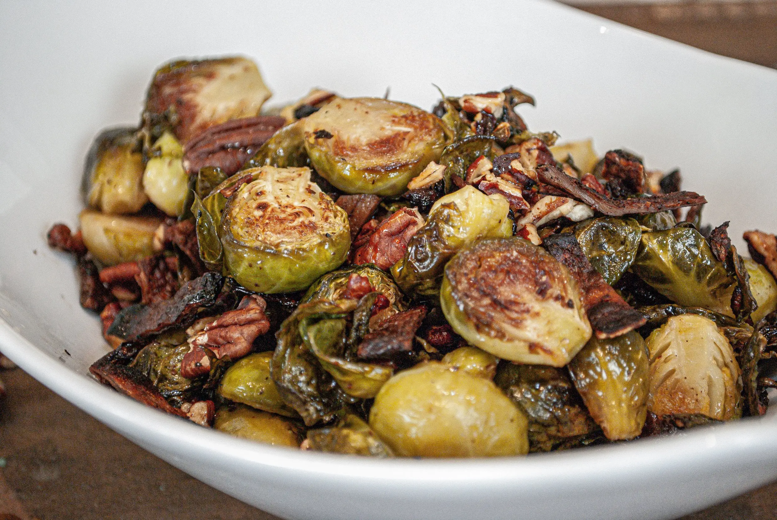 Close-up shot of Maple Pecan Roasted Brussel Sprouts featuring MyBacon